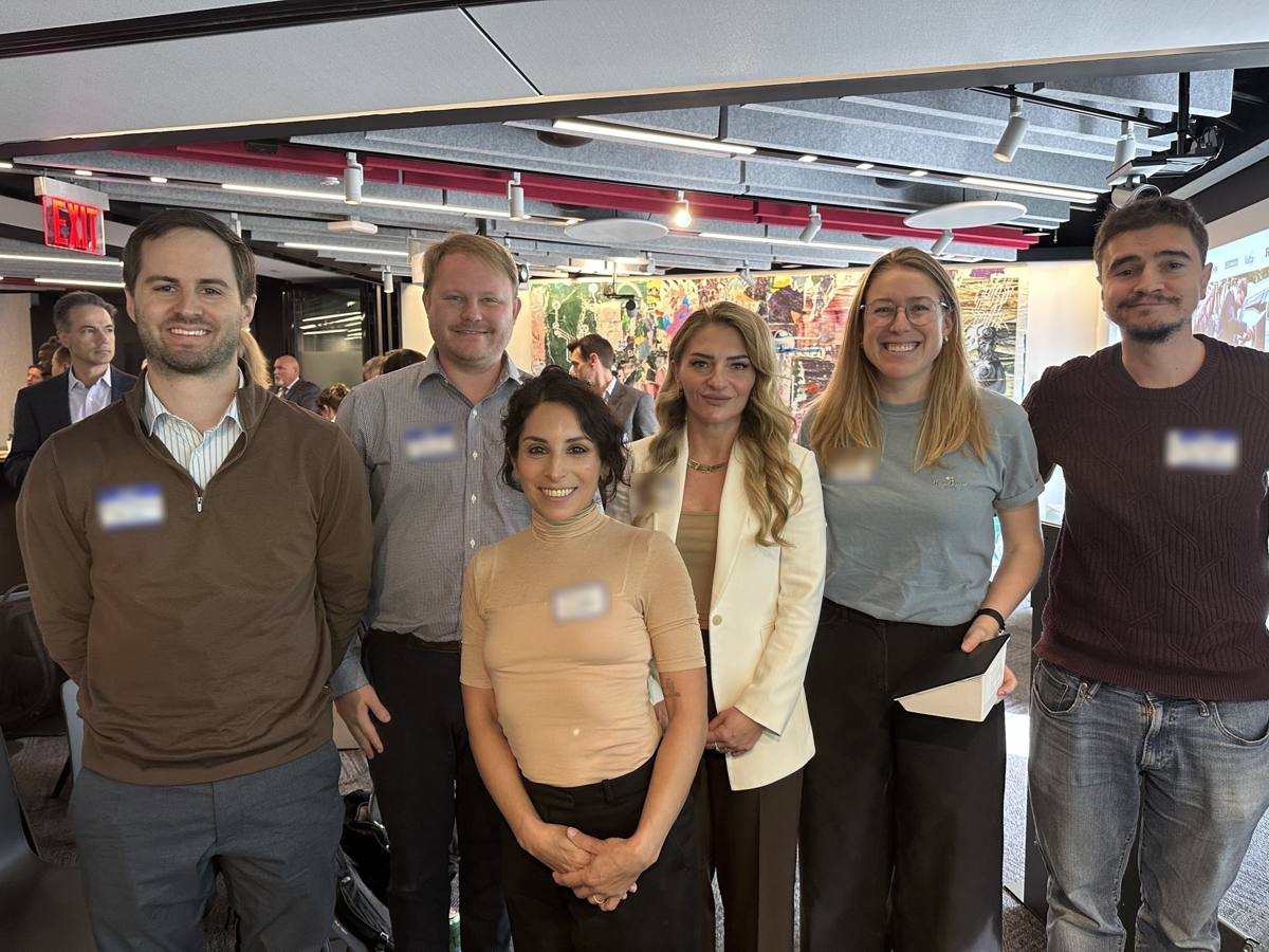 Founders and attendees posing together at a Climate Week event.